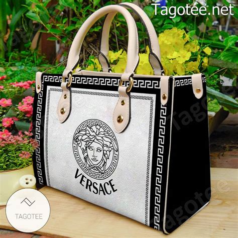 versace cltch|Versace black and white purse.